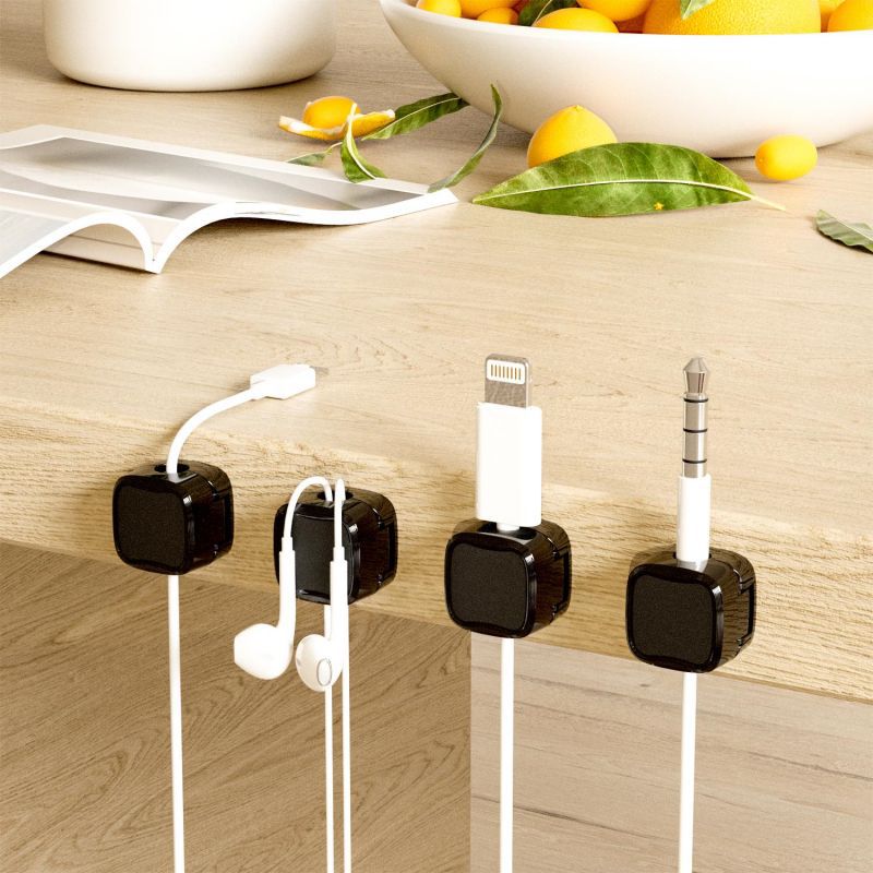 Magnetic cable clips for tidy charging cables